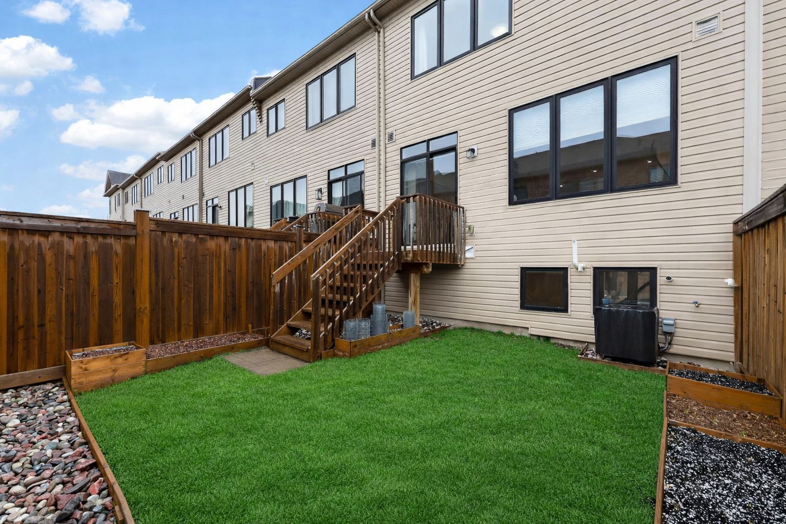 Backyard oasis with wooden stairs